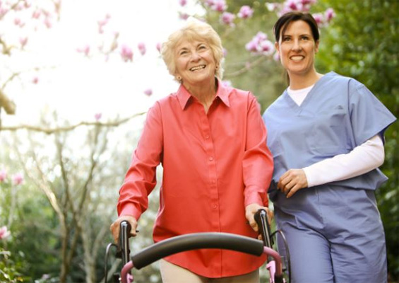 Nurse helping elderly woman